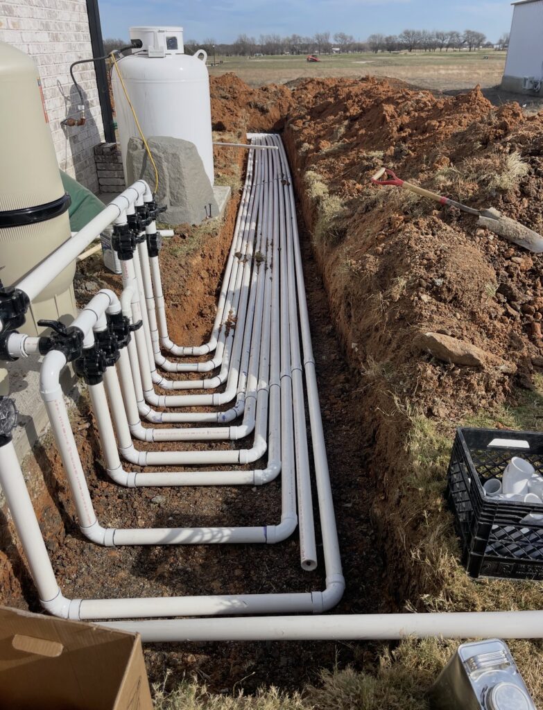 PVC plumbing lines installed for residential swimming pool equipment