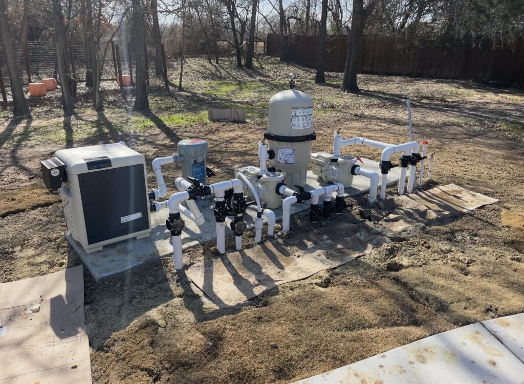 Residential swimming pool pump, filter, heater, and plumbing equipment setup
