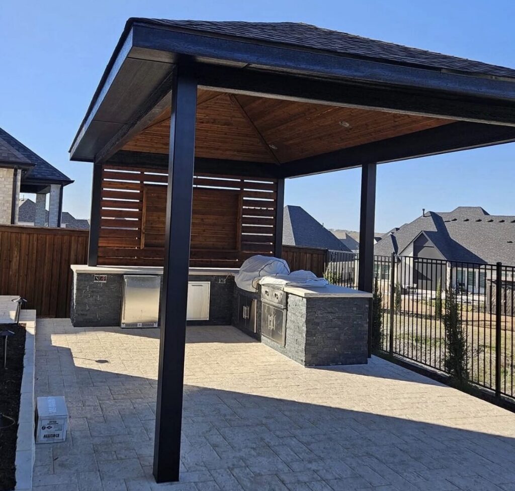 Backyard outdoor kitchen and covered patio built for a home in Garland, TX